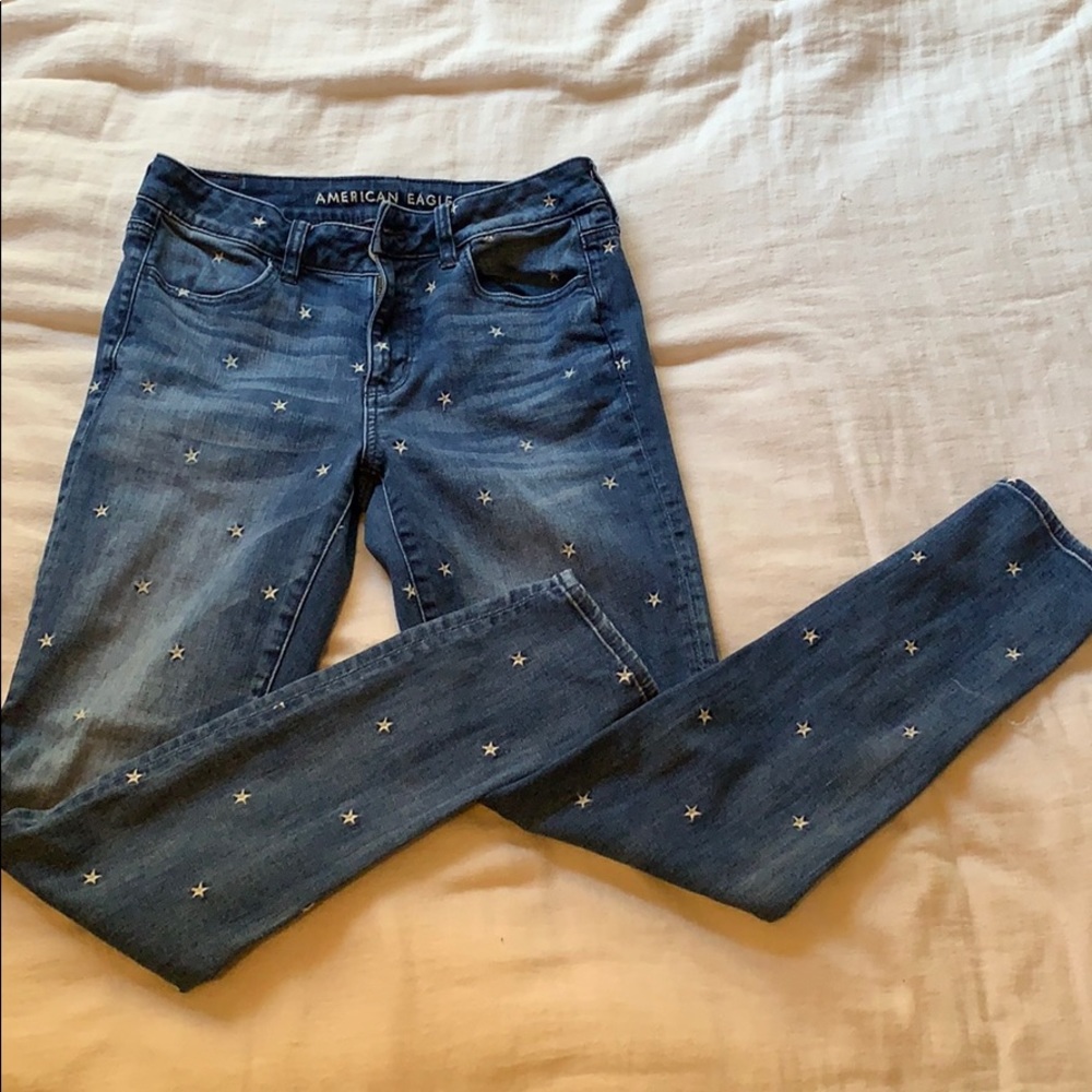 Denim jeans with white star embroidery
